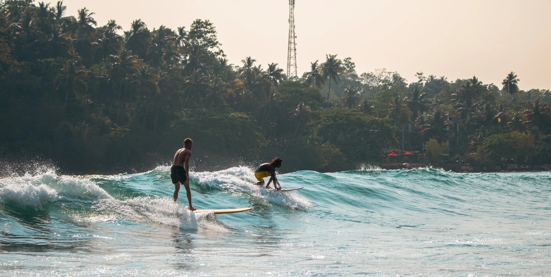 Horseshoe-shaped bay surrounded by jungle at Hiriketiya, Sri Lanka
