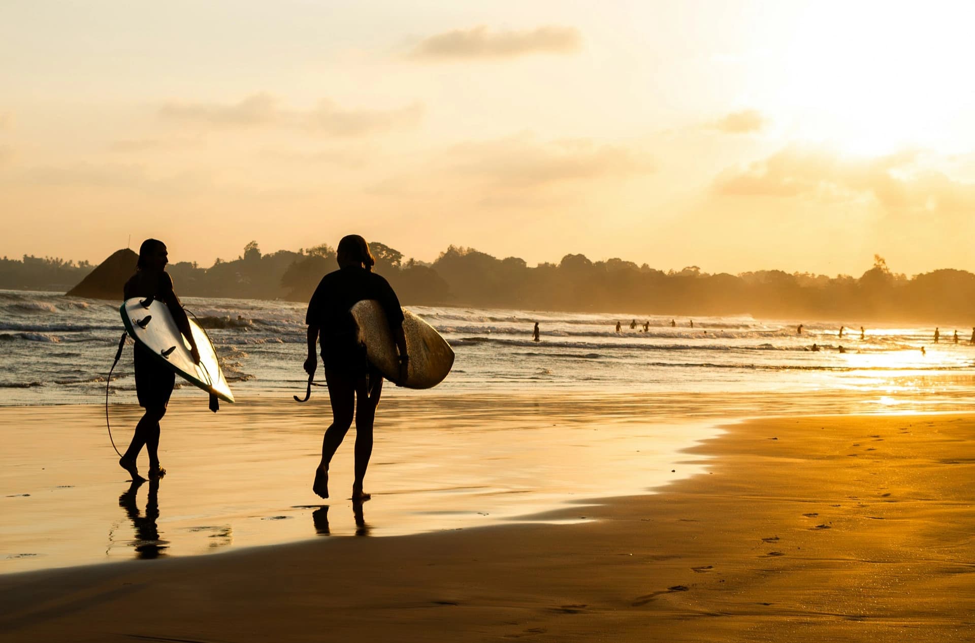 Beginner surfers in the bay at Weligama, Sri Lanka
